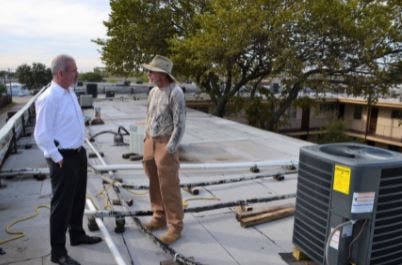 Customer and Oncor employee discuss HVAC