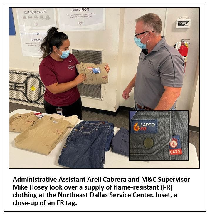 Oncor employees look over FR clothing 