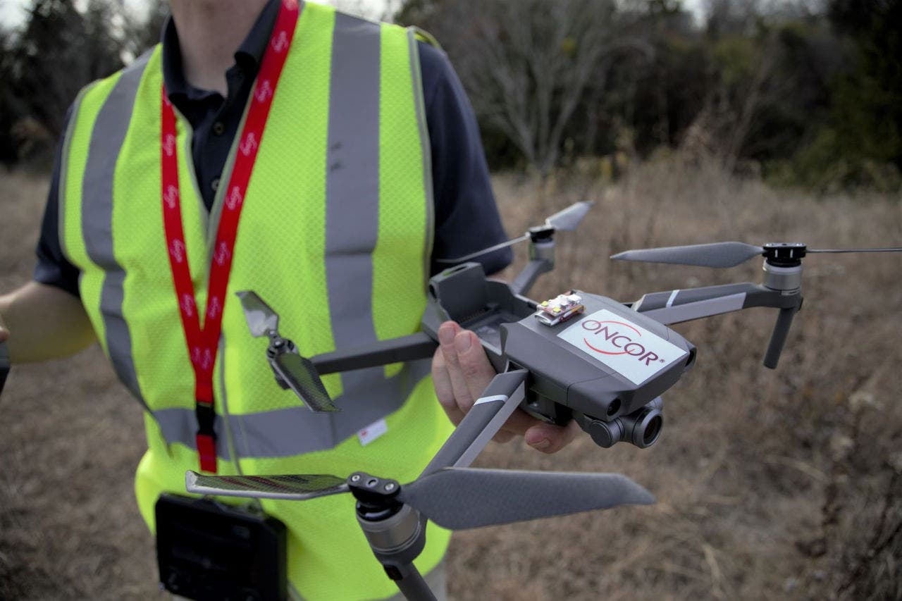 Oncor employee holding drone 