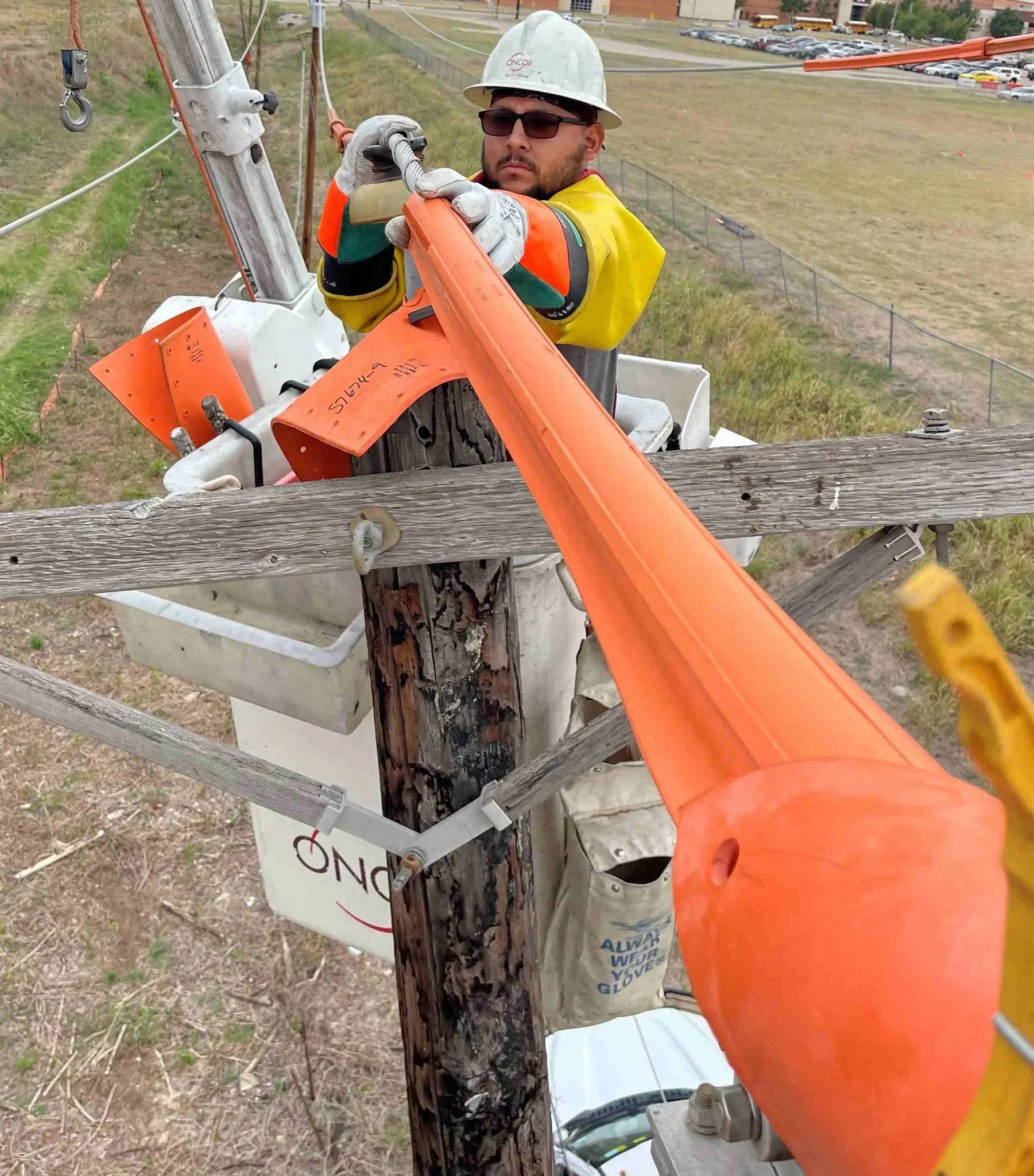 Oncor lineman working on pole