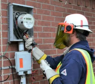 Person in the field working on meter