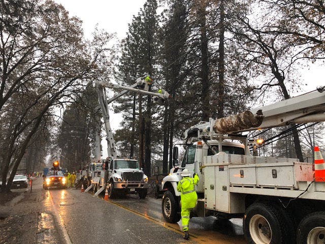 bucket trucks repairing lines