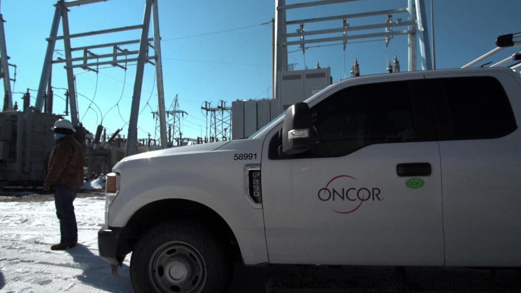 Oncor employee working in the snow